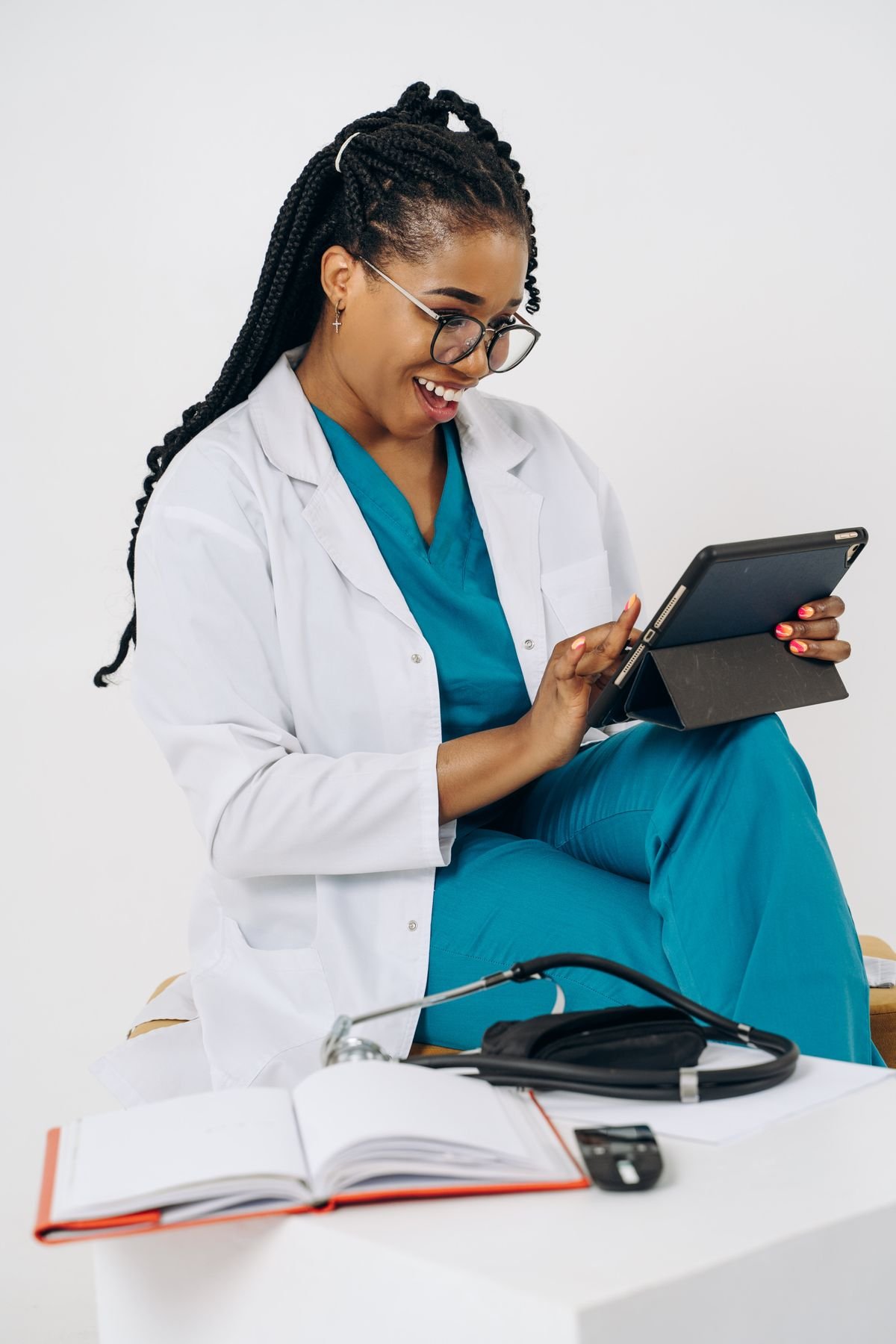 A doctor using a tablet to support patient care